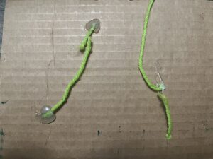Hot glue string on spring stem activities