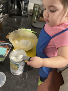 scooping little kitchen helper